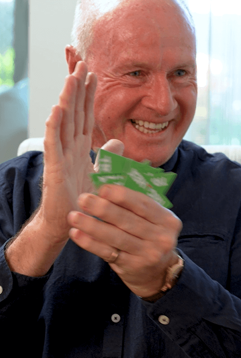 Older adults smiling while playing the easy-to-learn strategy game Trigahex