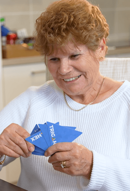 Grandparents enjoying a relaxed and replayable game of Trigahex with family