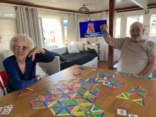 Older adults playing Trigahex, engaging in brain-boosting strategic gameplay