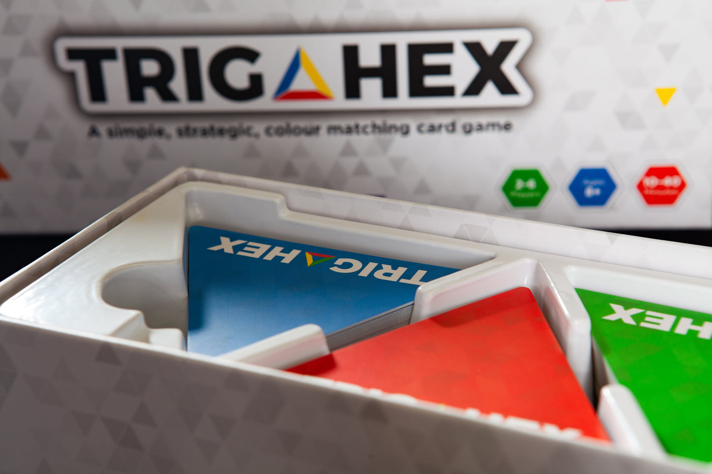 A detailed view of the Trigahex game box, showcasing its vibrant design and branding for this easy-to-learn, family-friendly strategy card game.