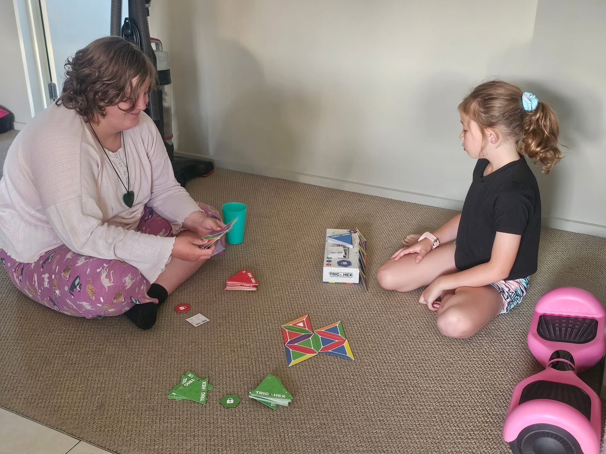 Kids enjoying a family-friendly card game of Trigahex